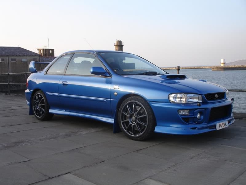 Blue Subaru Impreza on quay side
