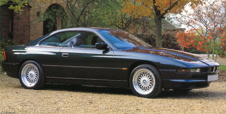 BMW 8 Series parked on gravel drive